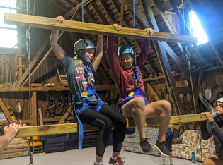 Two women climbing the giants ladder